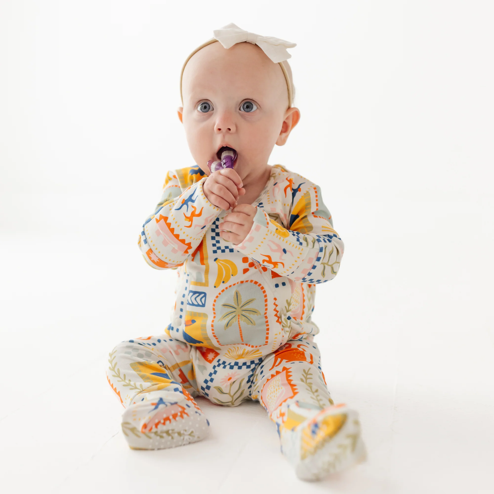 Baby wears Brazil inspired Lio Rio romper